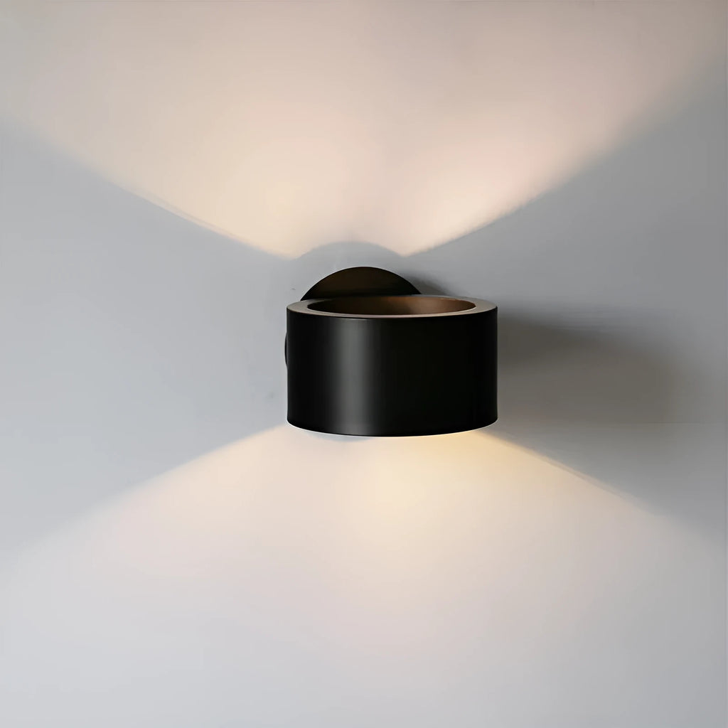 Modern iron wall lamp with copper gold finish, 15cm diameter on a white wall