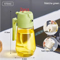 Glass olive oil sprayer and pour bottle with ergonomic handle in beige, yellow, green, or black, 470ml capacity.