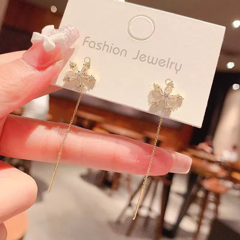 Long style gold dangle earrings for women with metal construction
