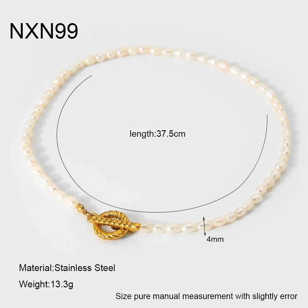 Women's freshwater pearl and geometric stainless steel necklace and bracelet set on a grey background