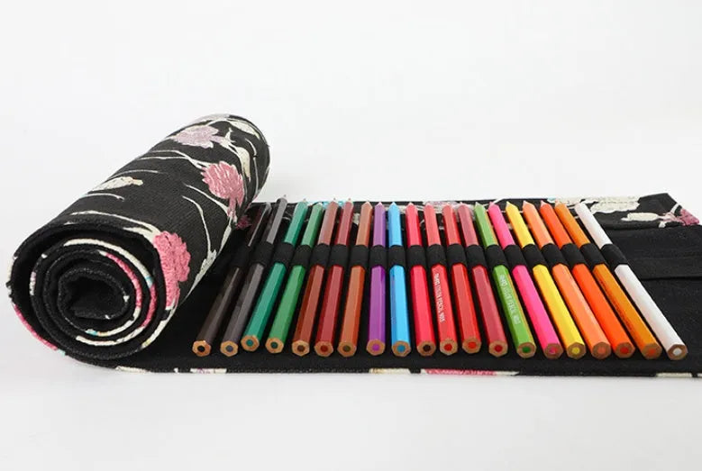 Canvas rolling pencil case with ballet girl print, showing multiple pencils organised in holes.