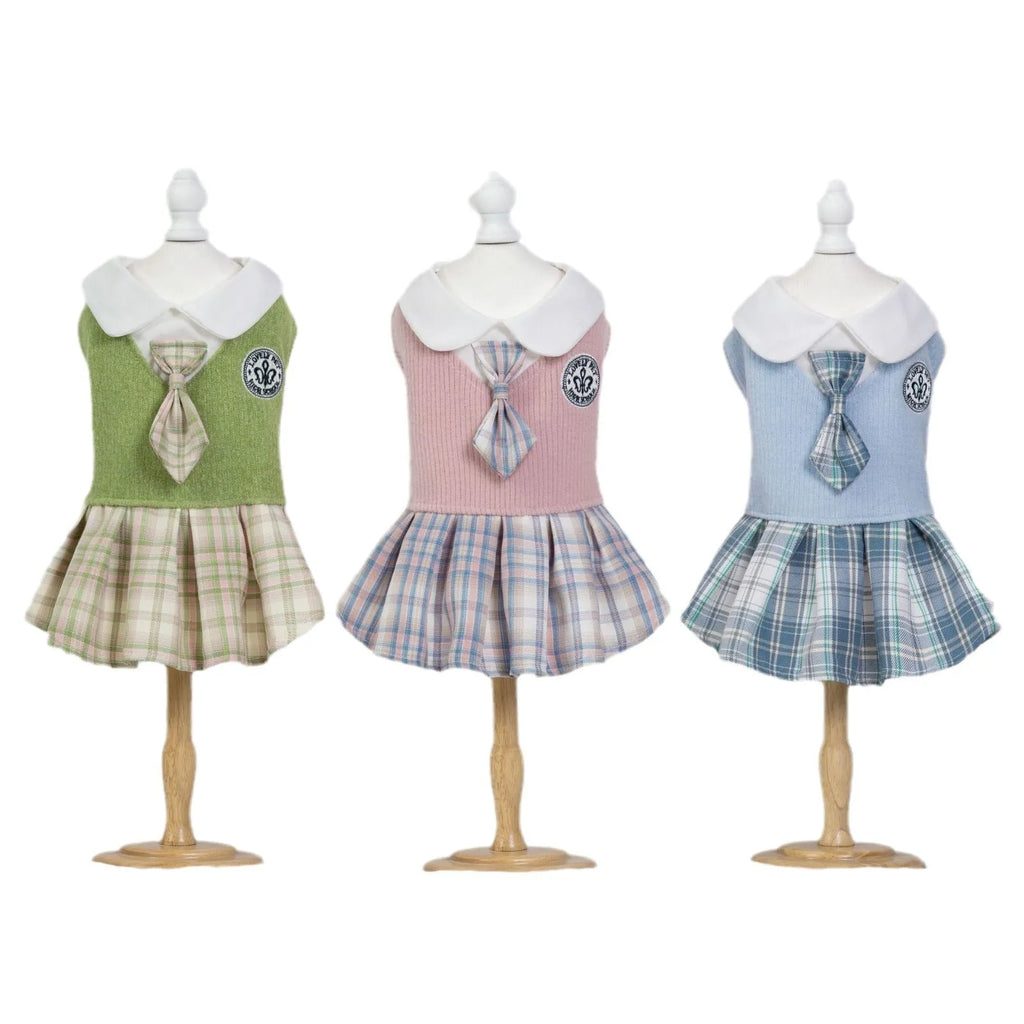 A pink tartan princess-style skirt for small dogs or cats, shown alongside blue and green colour options.