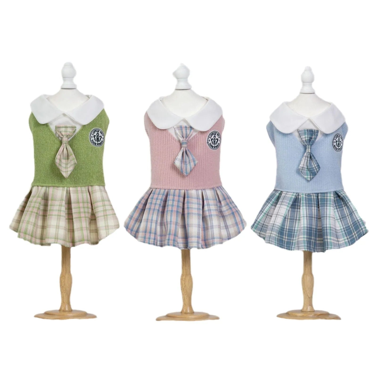 A pink tartan princess-style skirt for small dogs or cats, shown alongside blue and green colour options.