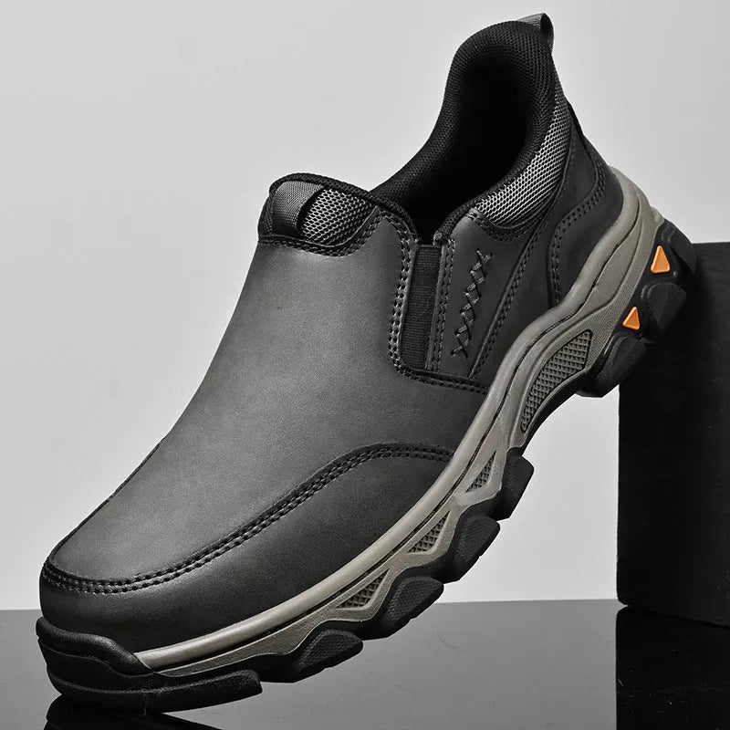 Men's dark brown casual leather shoes with round toe and flat rubber sole.