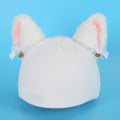 Soft plush ski helmet decoration cap with cartoon design on a blue background.
