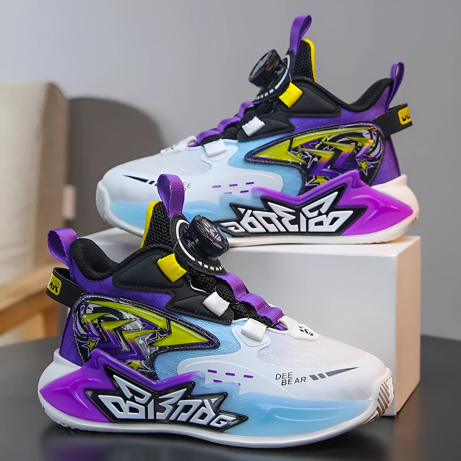 Children's mesh breathable basketball shoe in black, white blue, and purple colour options with lace-up closure