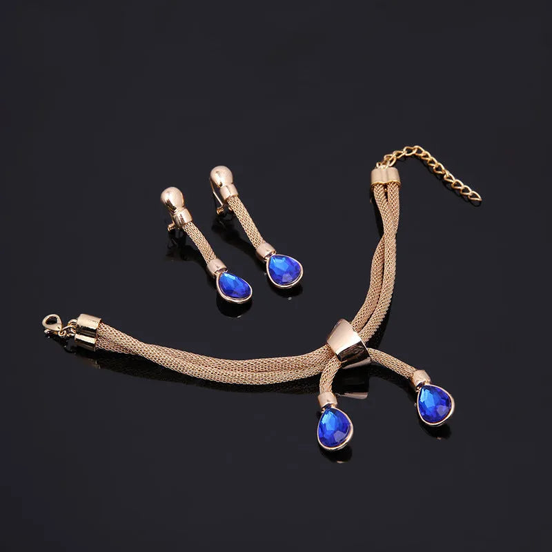 Four-piece gilded women's jewellery set with alloy diamond-finish square pattern, including necklace, earrings and bracelet in 18K gold colour