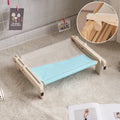 Solid wood cat bed with removable cushion in grey-toned seasonal pattern colours