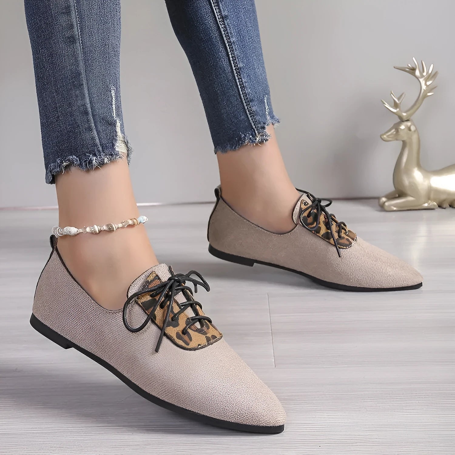 Beige leopard print pointed toe court shoes for women with a low block heel, shown in a plus size fit.