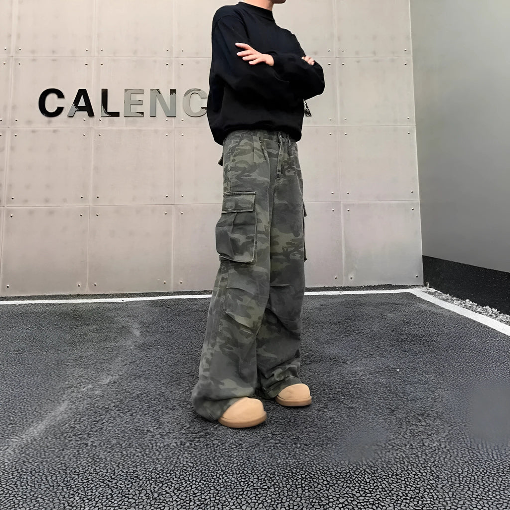 American Vintage camouflage cargo pants with multiple pockets and a washed, crumpled fabric texture.
