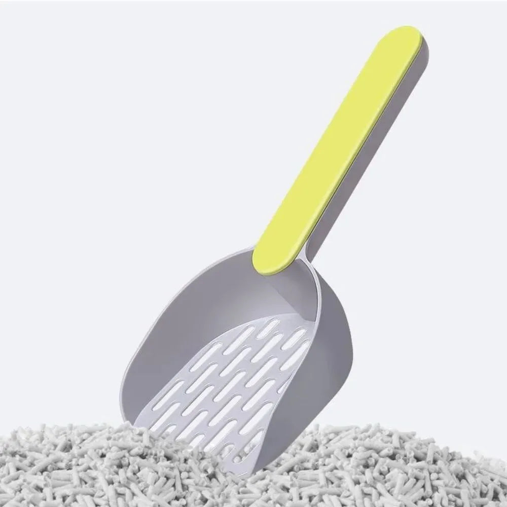 Blue plastic cat litter shovel scoop for cleaning litter boxes, shown next to a litter tray.