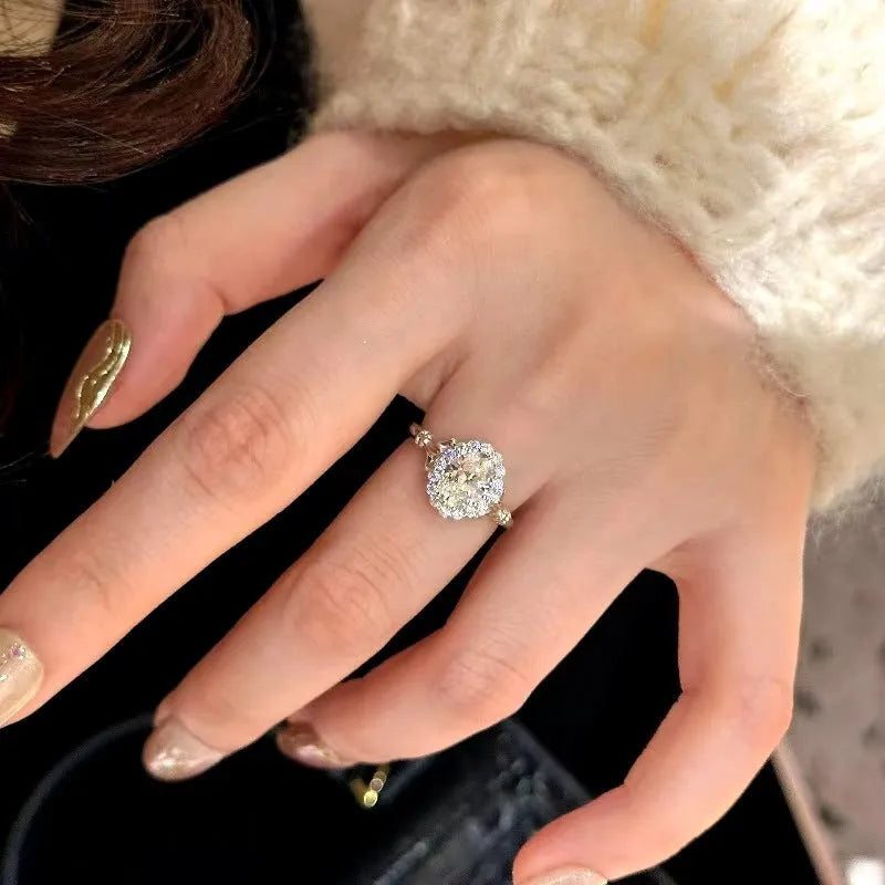 Silver geometric women's ring with big diamond bridal bouquet design and adjustable opening.