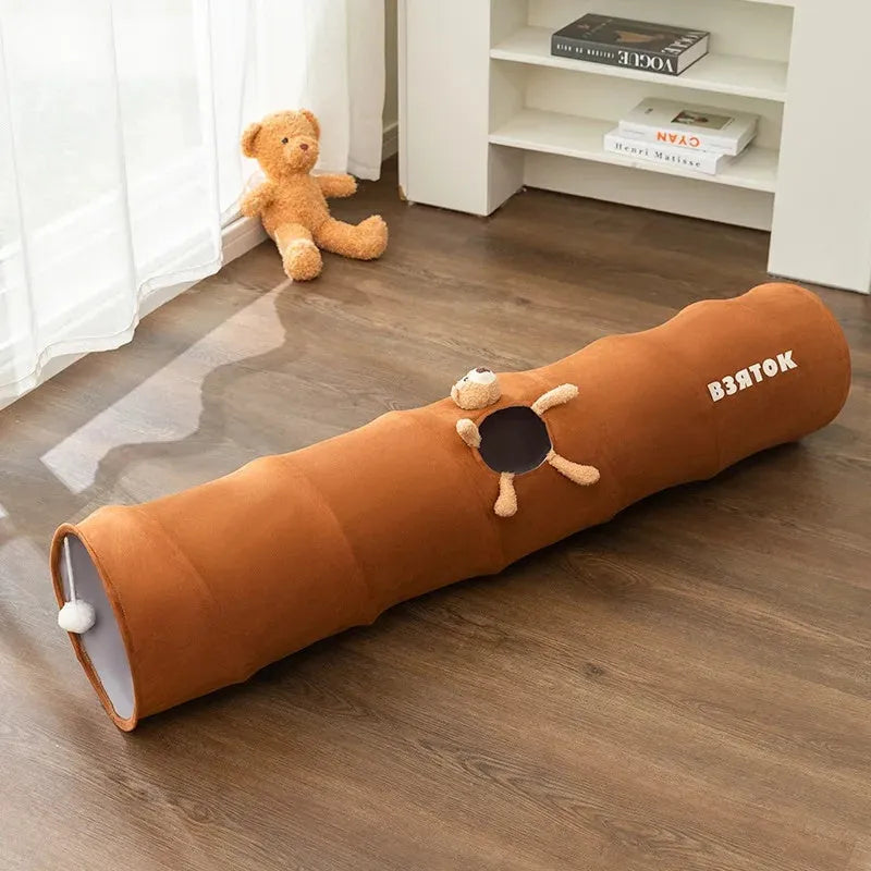Collapsible cat tunnel with plush ball in brown or grey, showing foldable steel wire frame and suede fabric