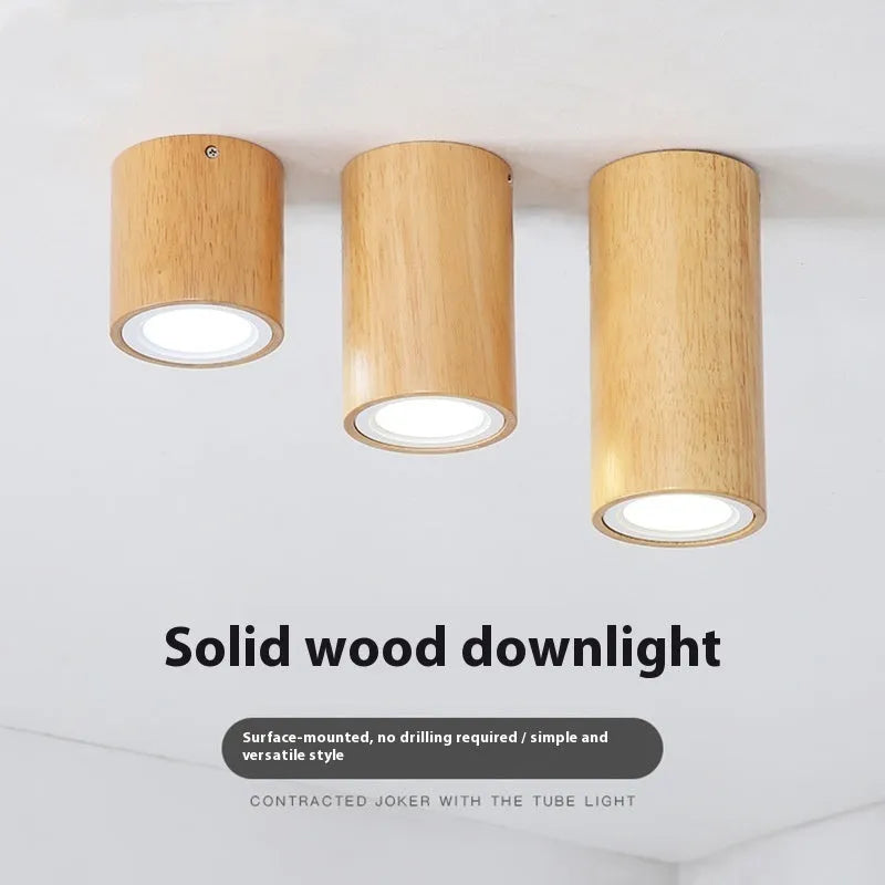 Modern solid wood surface mounted downlight in wood colour, shown in round and square shapes.