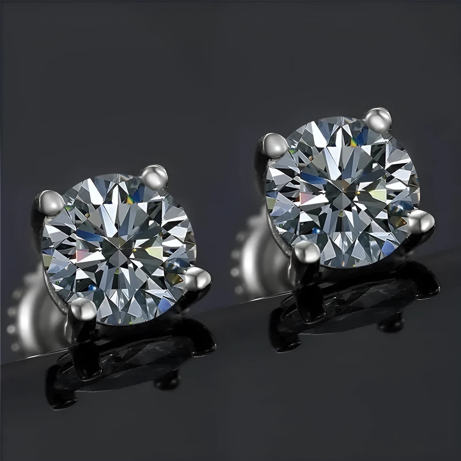 Silver screw-back moissanite stud earrings with geometric design and four-claw stone settings