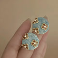 Mixed material geometric earrings with drip-glazed rose zircon detail, electroplating finish, mid-century style unisex design