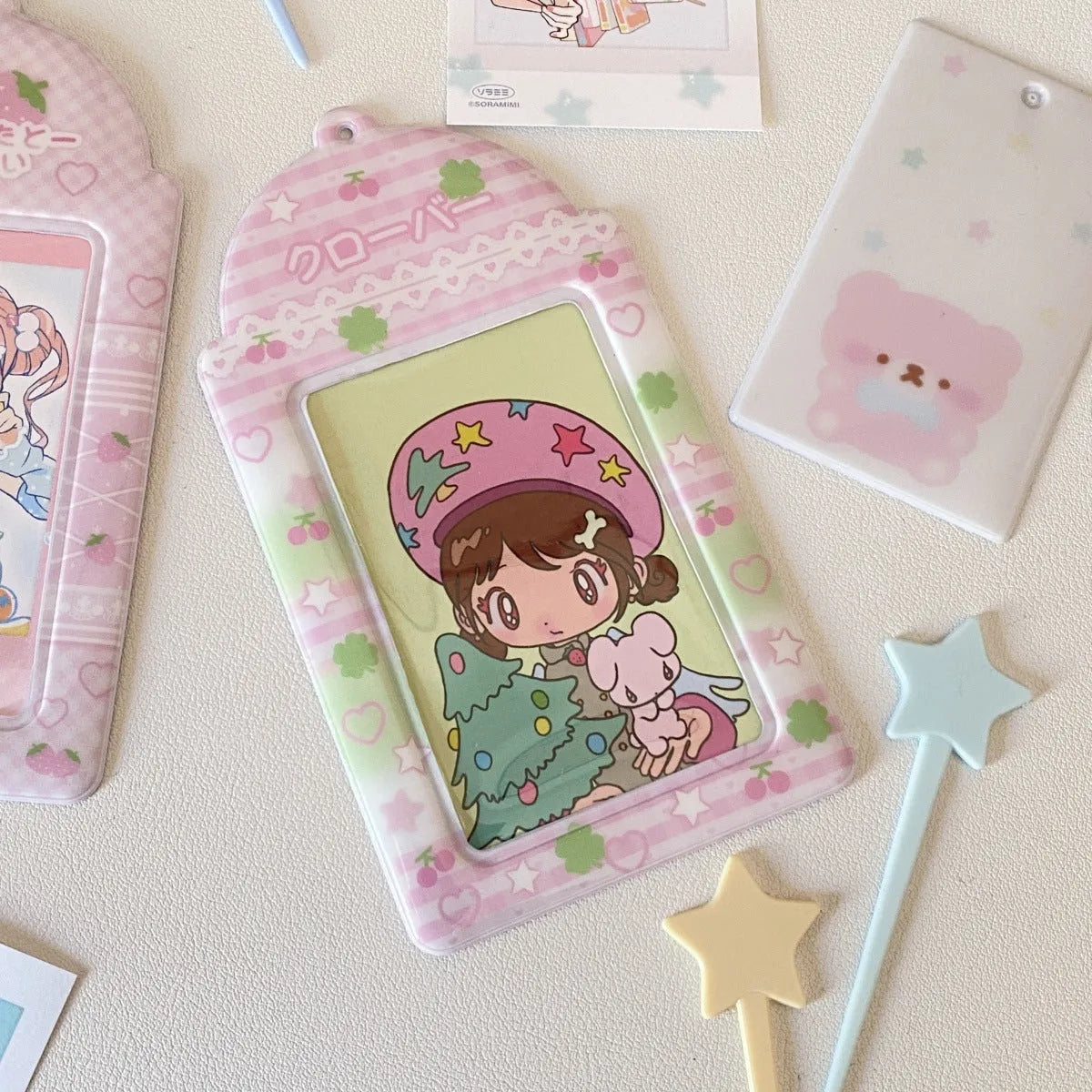Cartoon strawberry and four-leaf clover PVC meal card holder pendants showing 3-inch card window