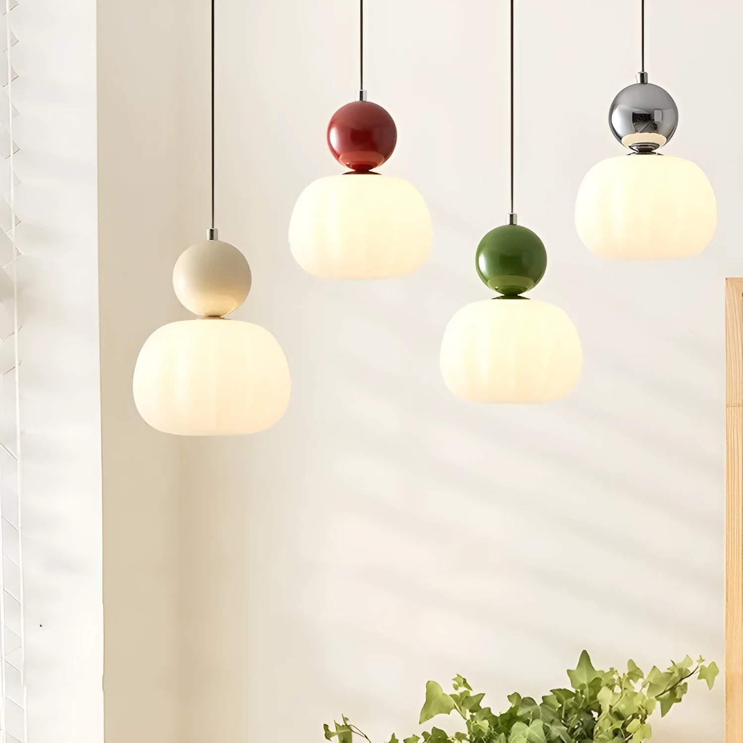 Nordic style pumpkin-shaped alloy chandelier with either one or three light heads in various colours.