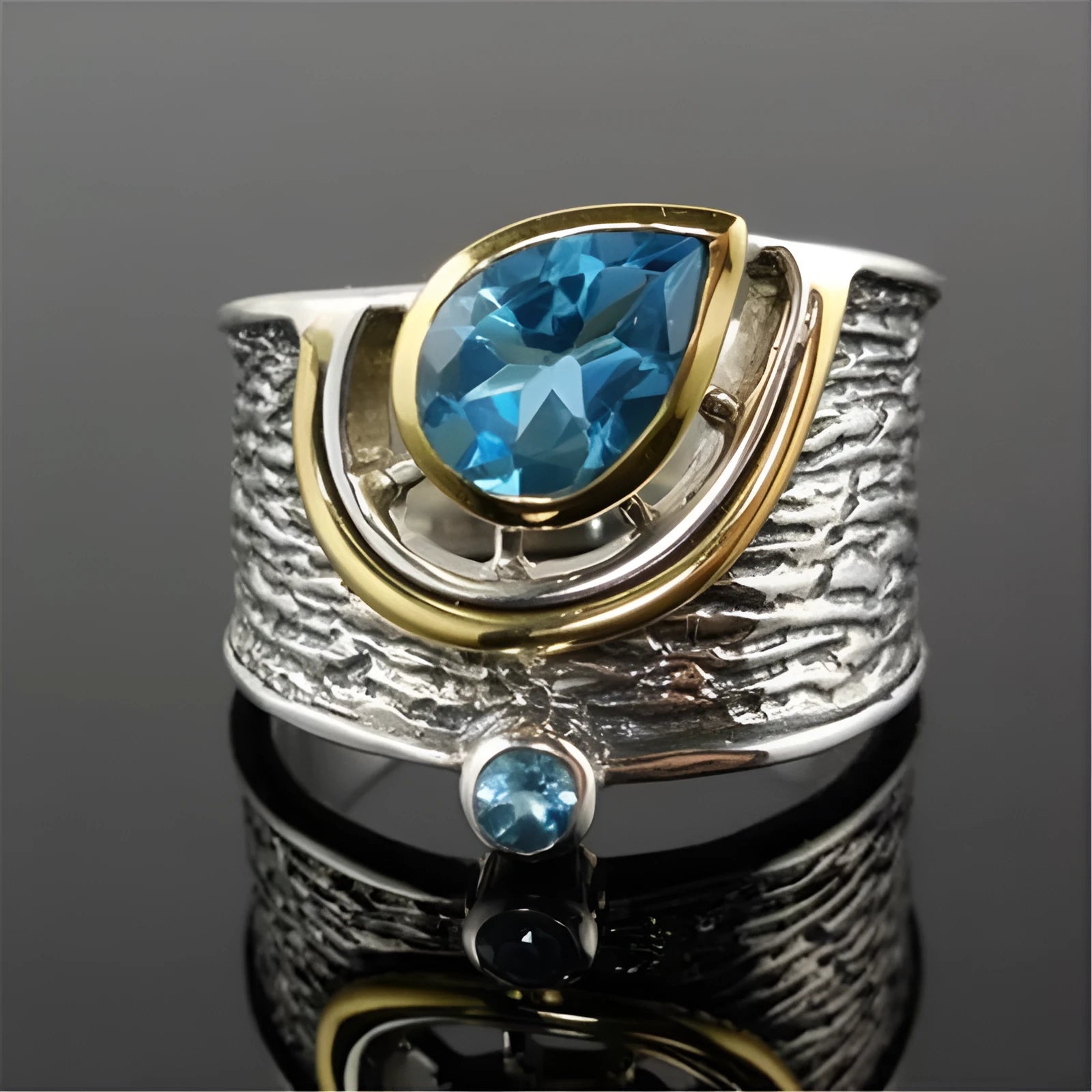 Blue zircon Chinese style women's ring with inlaid design showing drop shape silhouette
