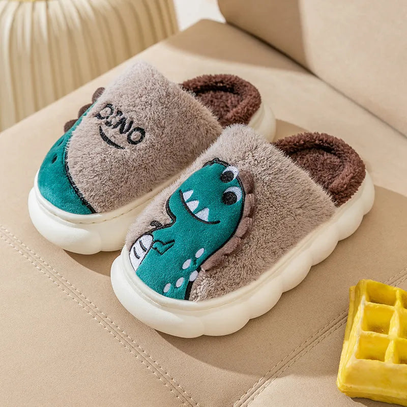 A pair of plush dinosaur-themed slippers for indoor wear, shown in a choice of colours.