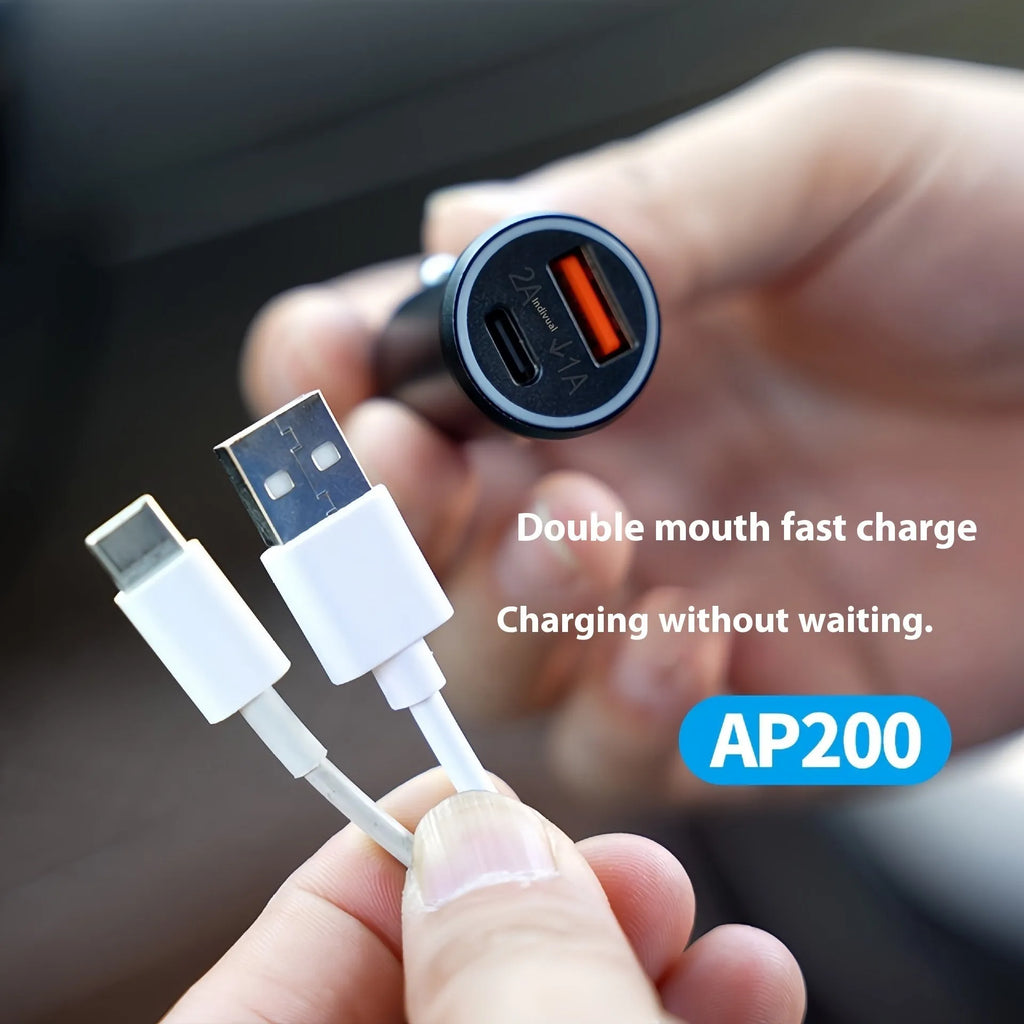 Black car GPS locator with a 12V cigarette lighter plug and a coiled 1.5-metre power cable on a dark surface.