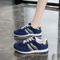 Blue women's casual sports shoes with cross shoulder straps and a white rubber sole.