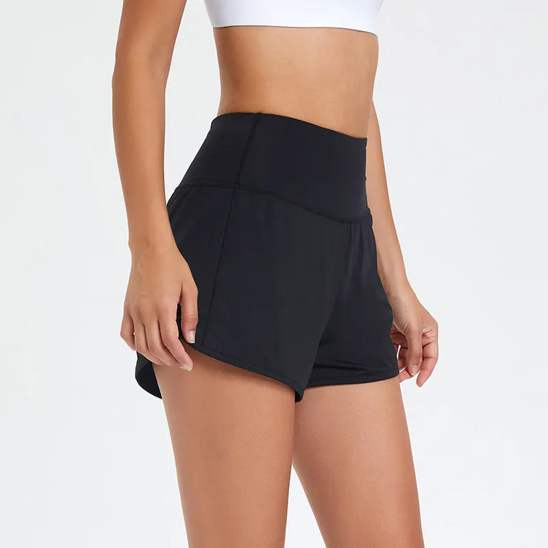 Women's high-waist nylon sports shorts in water blue, shown for summer fitness and running.