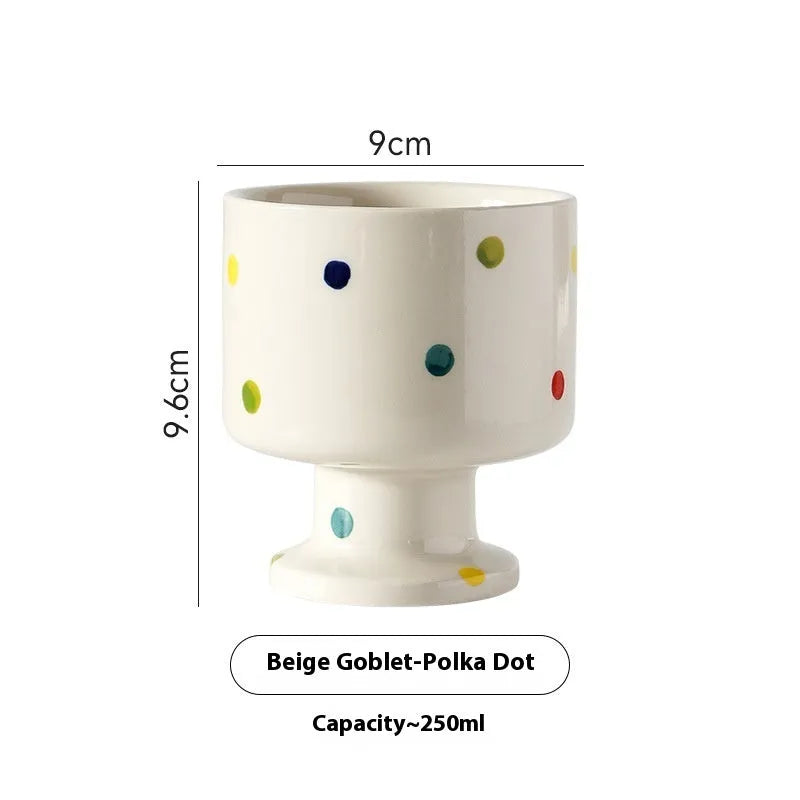 Hand-pinched irregular shaped ceramic mug in a solid colour on a plain background.