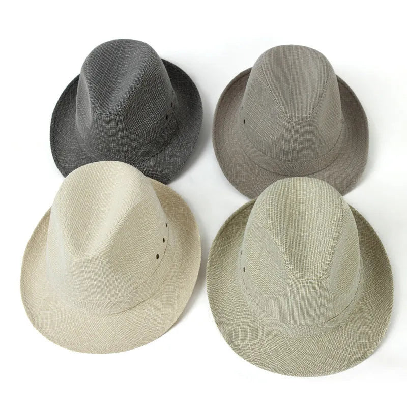 A man's brown fedora hat with a pinched crown and a medium-width brim on a wooden table.