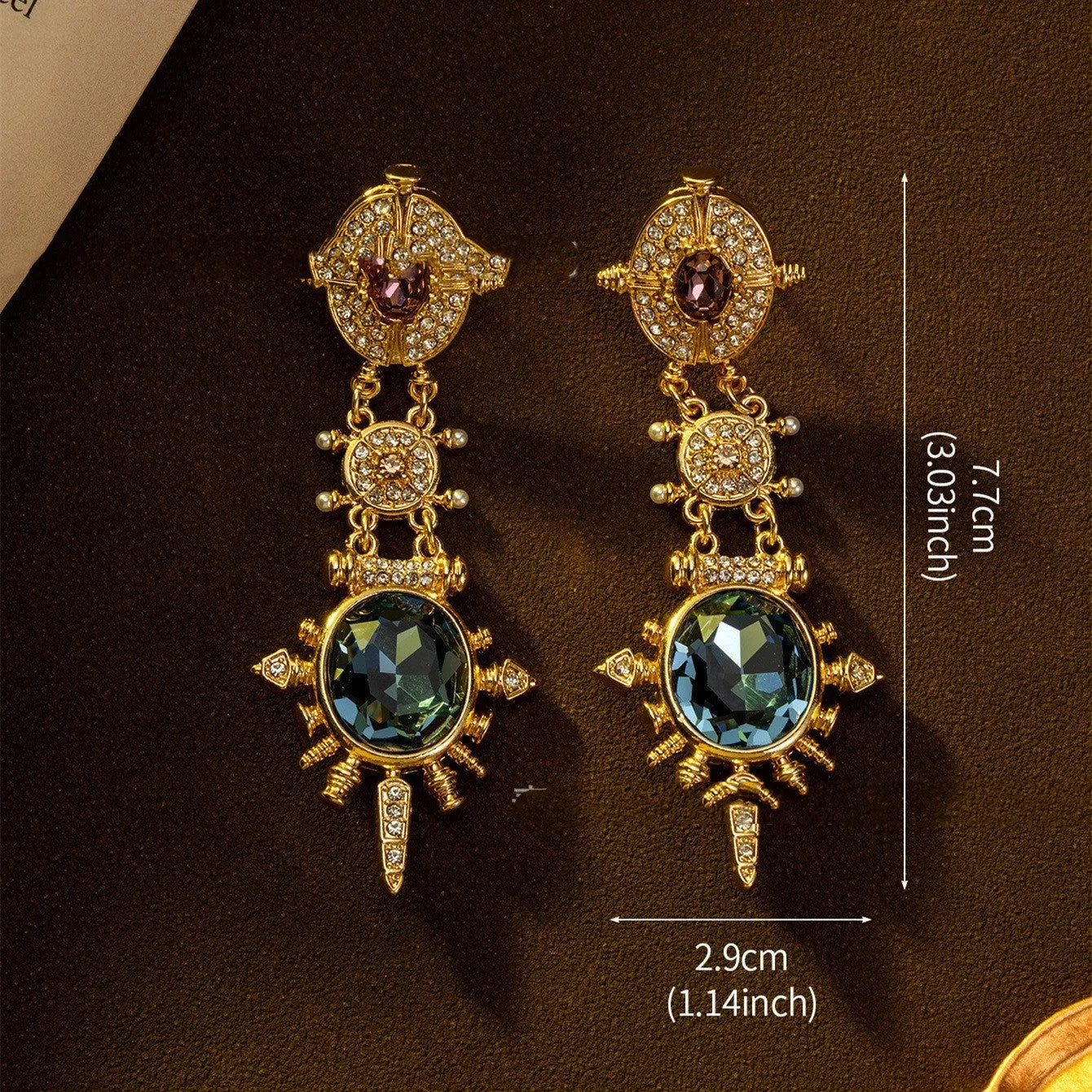 A pair of round geometric stud earrings with a gold finish and retro court style design.