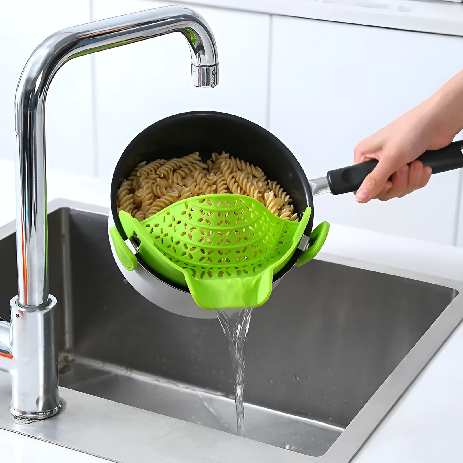 Silicone and stainless steel pot drain stopper kitchen gadget in assorted colours.