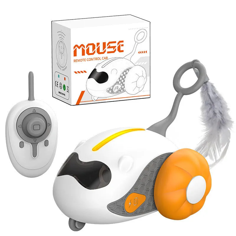 Charging Cat Teaser remote control toy with feather attachment in orange plastic body on floor