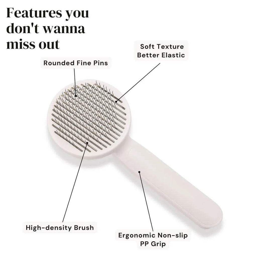 Blue grey pink self-cleaning pet grooming brush with ergonomic rubber handle.
