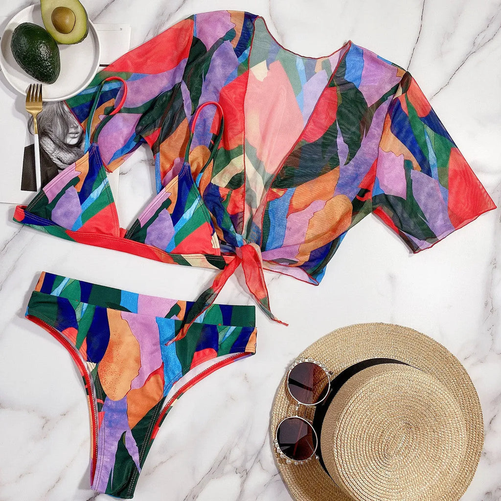 Red women's split-leg bikini swimsuit with triangle top on a mannequin.