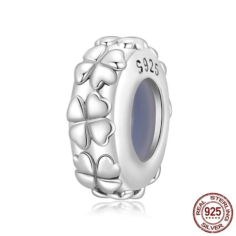 S925 sterling silver four-leaf clover positioning spacer bead with pearlescent finish on white background