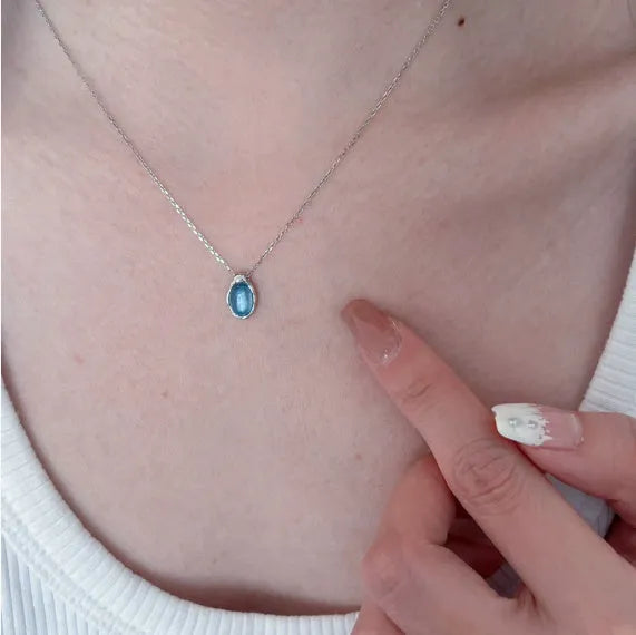 Navy blue geometric water drop pendant necklace on a cross chain, adjustable 41-50 cm.