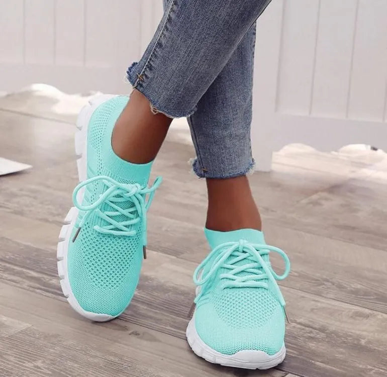 Women's breathable high-top lace-up platform sneaker in various colours on a casual background.