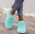 Women's breathable high-top lace-up platform sneaker in various colours on a casual background.