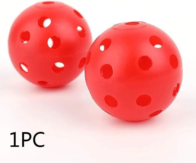 Assorted multi-colour 42mm golf practice balls with a net bag, shown next to practice putting holes.
