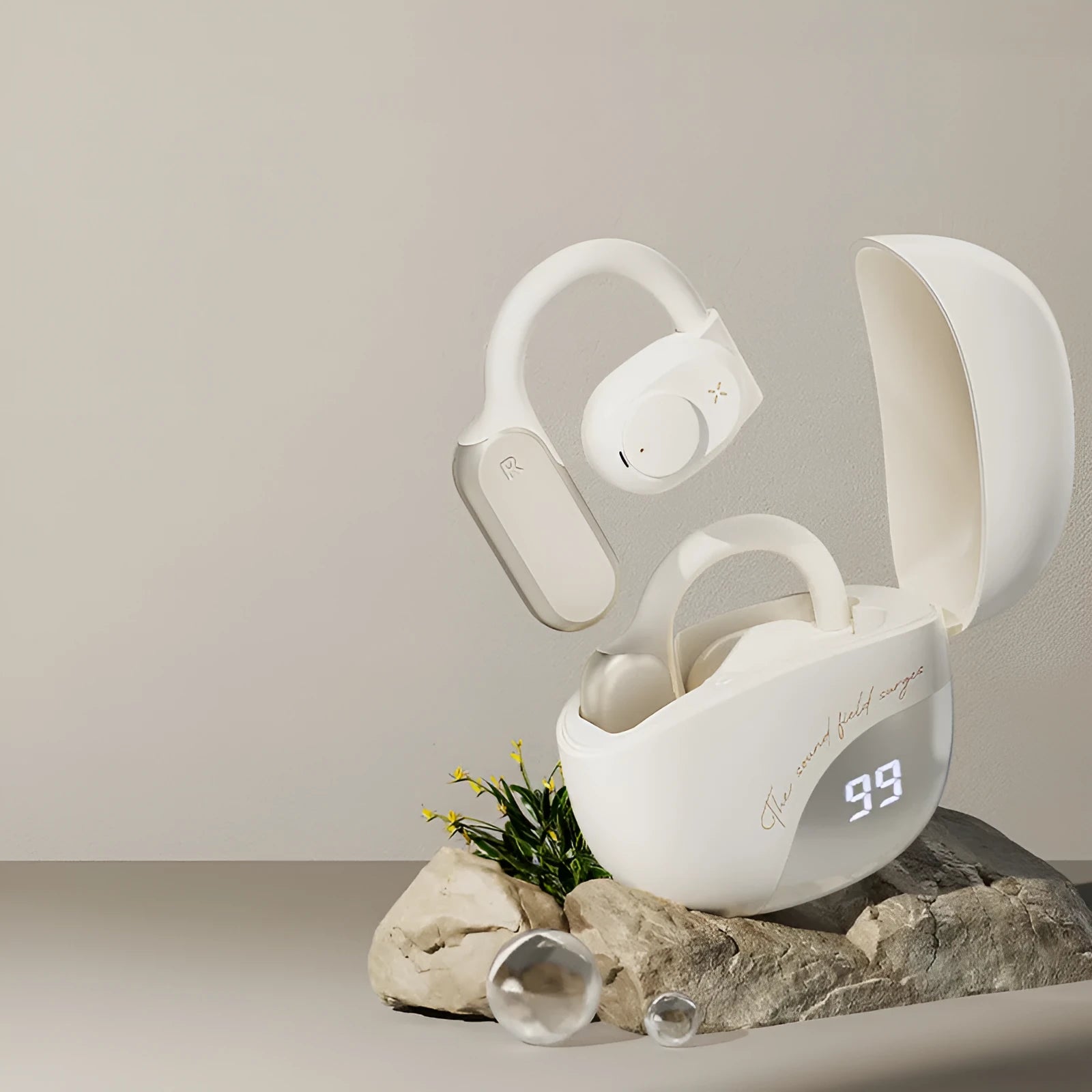 Bone conduction non in-ear Bluetooth headset in Glacier Blue with silicone ear hook on a white background