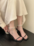 Mermaid Pearl Grace women's stiletto heel sandals in black, silver, or white with square toe and ankle-strap buckle