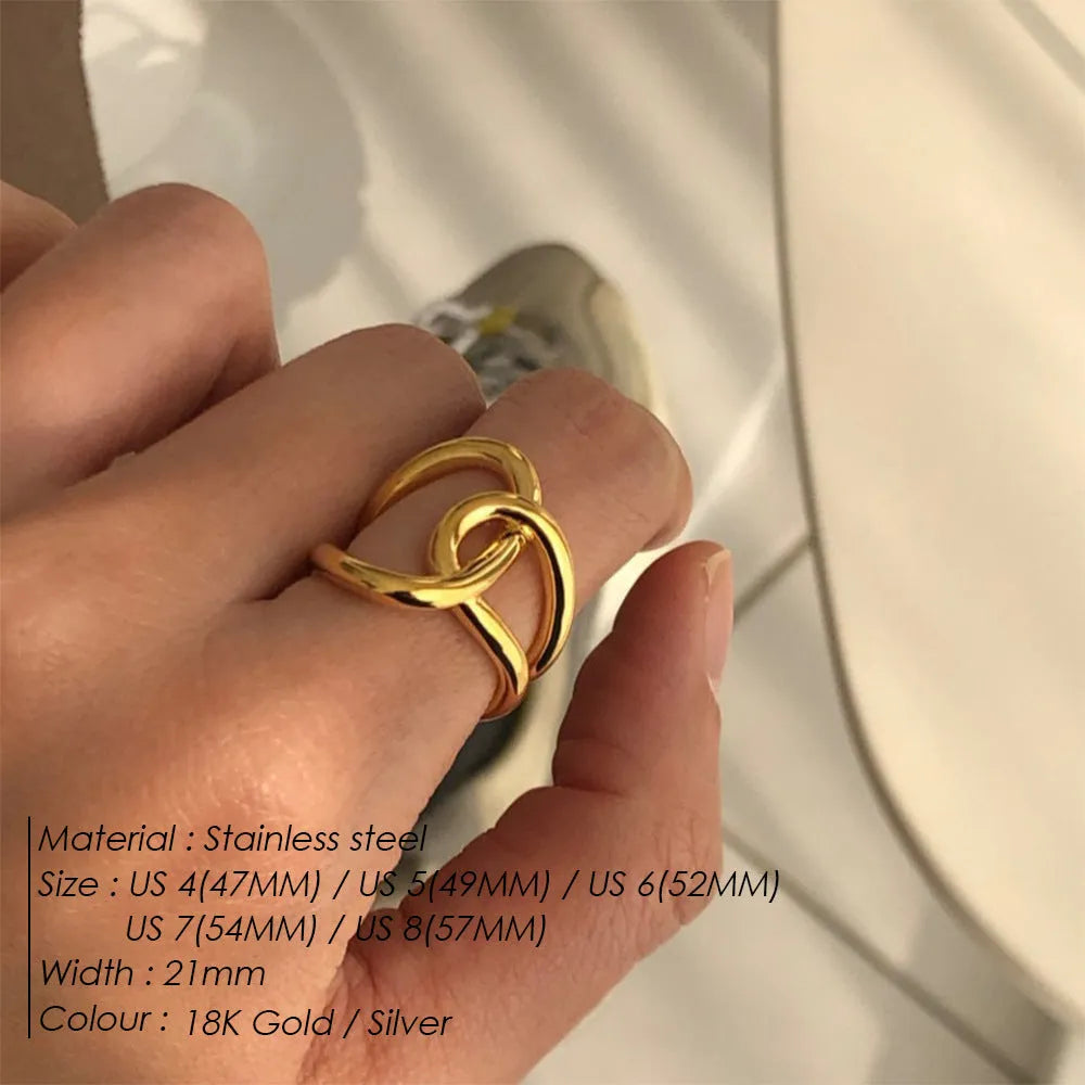 Adjustable knotted stainless steel ring for women in 18K gold or steel colour, showing U-shaped geometric design.
