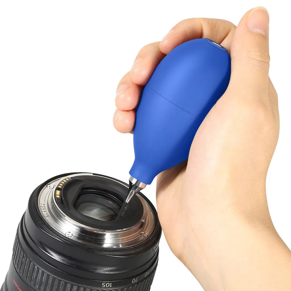 Blue and black handheld rubber dust blower cleaning tool for cameras and electronics.
