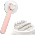Self-cleaning pet brush with blue rubber handle and metal pins, shown with removed fur.