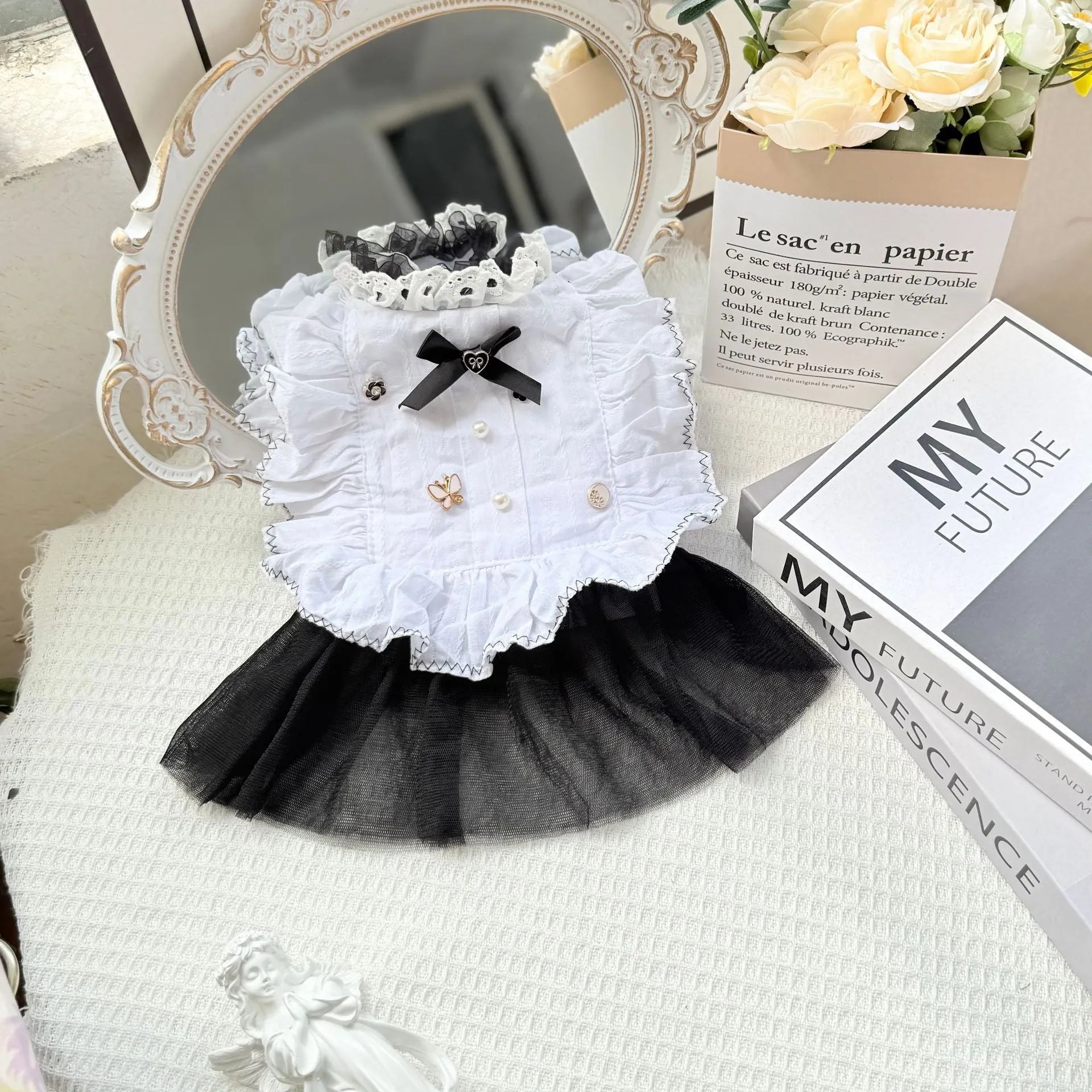 White polyester gauze skirt dog dress on a small dog, showing princess-style gathered skirt.