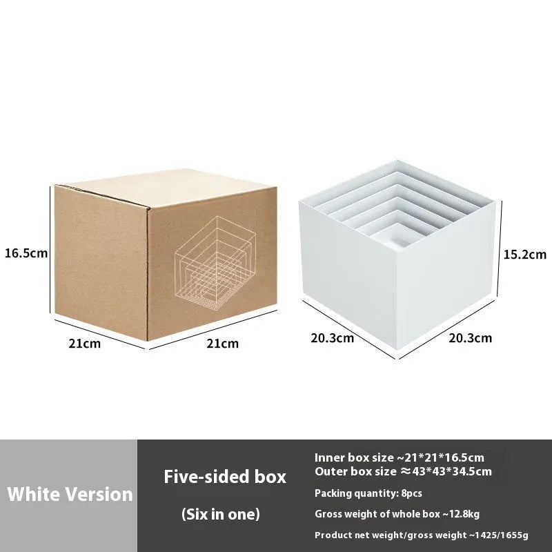 White plastic modular dessert display stand cubes stacked to form a tiered tabletop cake stand.