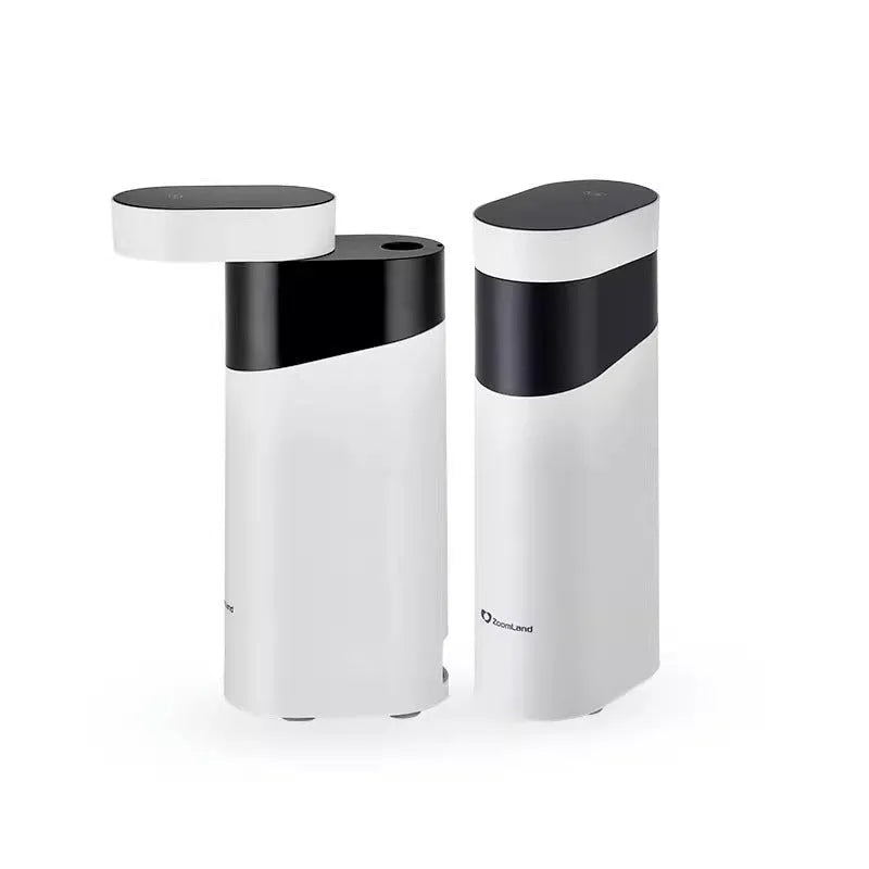 Small black instant water dispenser with digital display on a desktop.