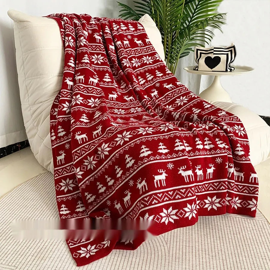 Personalised acrylic Christmas blanket showing reindeer and snowflake print options in two sizes.