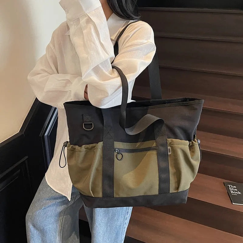 Women's Oxford travel bag in grey with 36-55L capacity and letter pattern