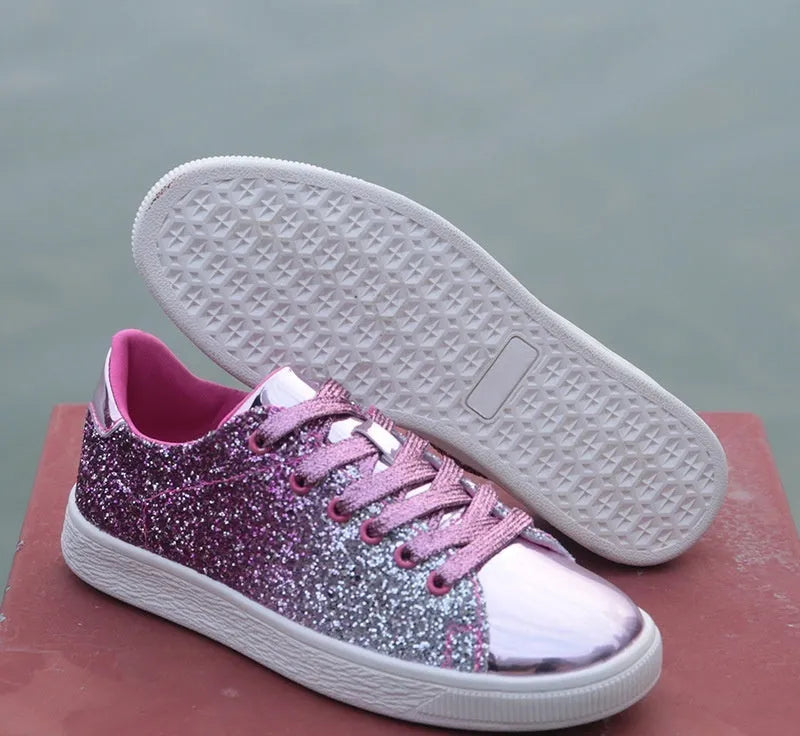 Women's low-top casual shoes with colourful sequin upper, round toe, and lace-up front in black, gold, or pink.